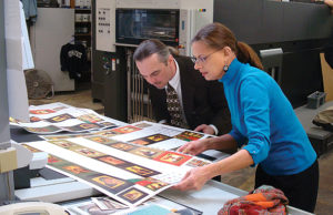 Michael and Nancy Sayre fussing over every detail of a print run.